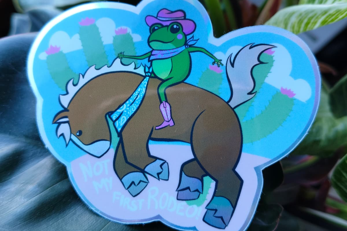 sticker of a cowboy frog on a horse